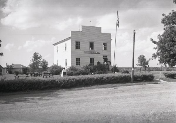 Exterior view from across road of the first Wisconsin territorial Capitol building, as restored, in Old Belmont (later changed to Leslie).